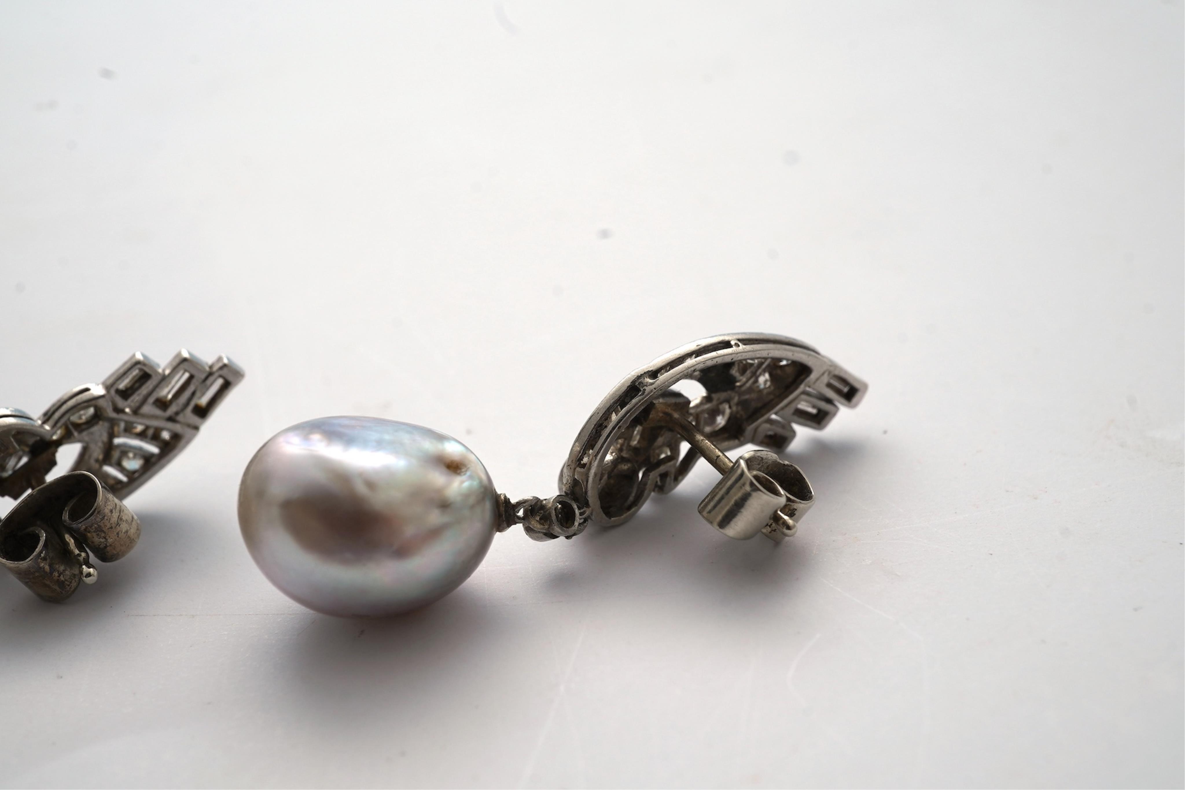 A fine pair of Art Deco natural pearl and diamond earrings, 1930s